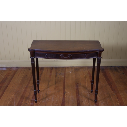 225 - A VINTAGE ADAM STYLE MAHOGANY FOLDOVER CARD TABLE of demi lune outline the shaped top with eared cor... 