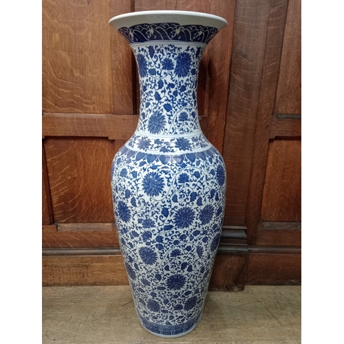 264 - A PAIR OF BLUE AND WHITE VASES each of bulbous form with flared rim the white ground with stylised f... 