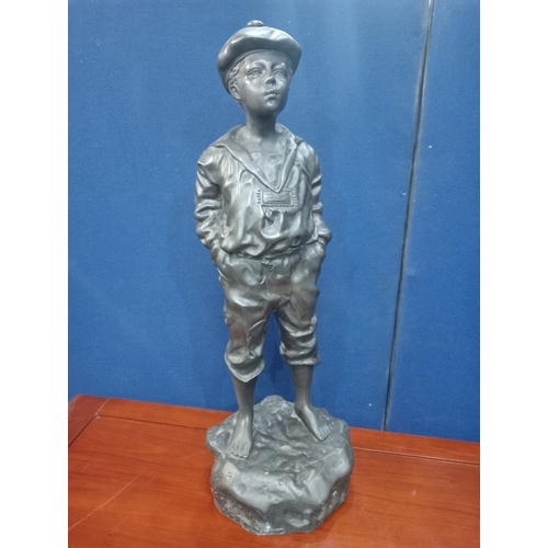 274 - after MARCEL A cast bronze figure modelled as a young boy shown standing on a naturalistic base 74cm... 