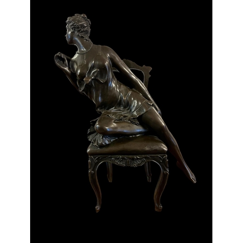 281 - after DANIEL CAMPAGNE An Art Deco style cast bronze figure modelled as female shown seated on a chai... 