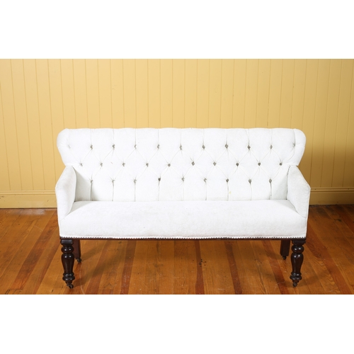 340 - A VICTORIAN STYLE SETTEE the rectangular back with a buttoned upholstered panel and seat on baluster... 