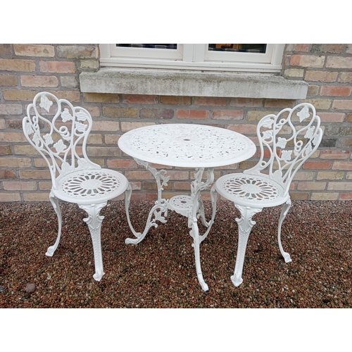 346 - A THREE PIECE CAST ALUMINIUM PATIO SUITE comprising a pair of chairs each with a pierced foliate dec... 