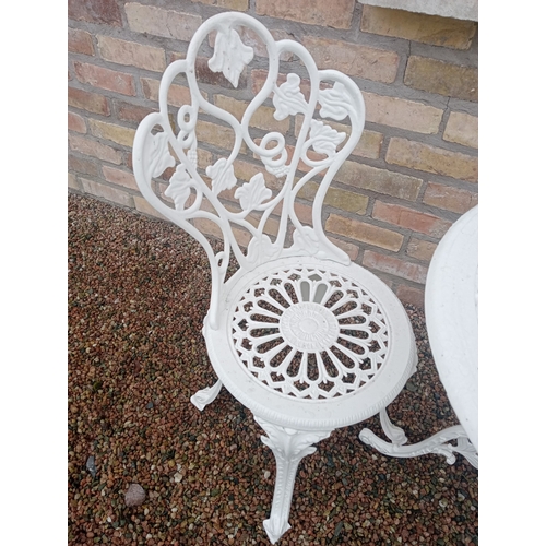 346 - A THREE PIECE CAST ALUMINIUM PATIO SUITE comprising a pair of chairs each with a pierced foliate dec... 