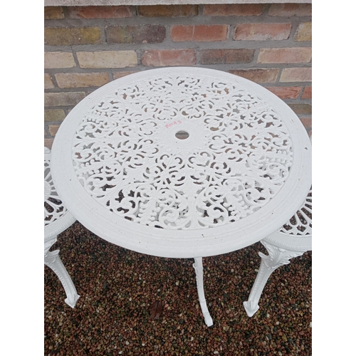 346 - A THREE PIECE CAST ALUMINIUM PATIO SUITE comprising a pair of chairs each with a pierced foliate dec... 