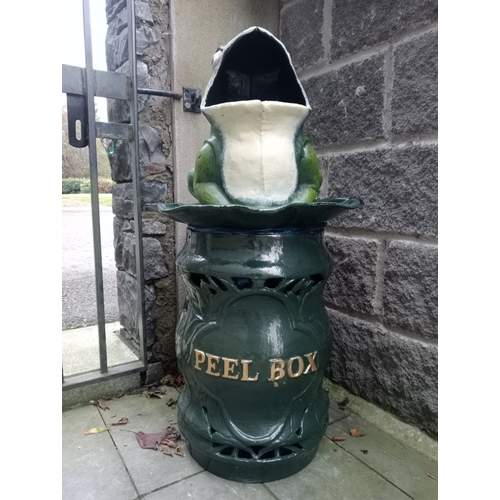 354 - A CAST IRON BIN modelled as a frog with leaf shaped dish above a rustic base inscribed 'peel box' 90... 