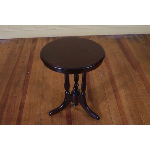 421 - A MAHOGANY WINE TABLE the circular moulded top raised on fluted and lobed supports with splayed legs... 