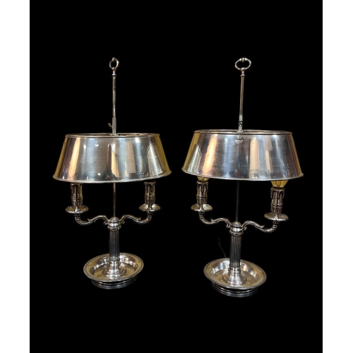 490 - A PAIR OF BOUILLOTTE PLATED TWO BRANCH TABLE LAMPS each with a reeded column with foliate scroll arm... 