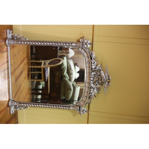 499 - A 19TH CENTURY CARVED WOOD SILVER FRAME OVERMANTEL MIRROR the rectangular arched bevelled glass plat... 