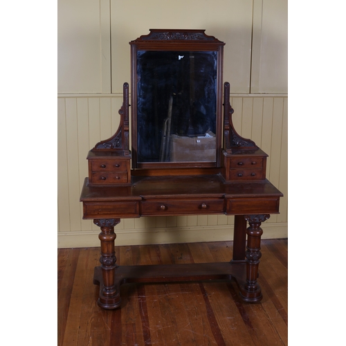 6 - AN EDWARDIAN CARVED MAHOGANY DRESSING TABLE the superstructure with swivel mirror flanked by four sh... 