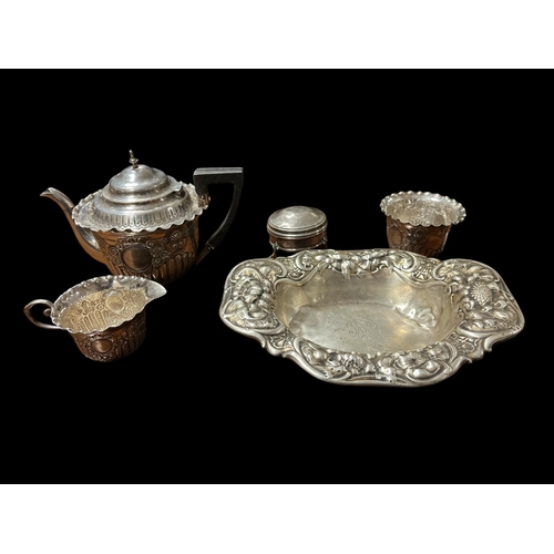 611 - A THREE PIECE SILVER EMBOSSED BACHELORS TEA SET comprising teapot, milk jug and sugar bowl 1897-1898... 