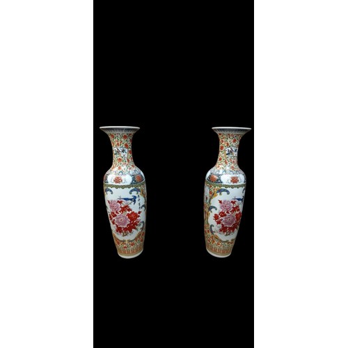 282 - A  PAIR OF LARGE IMARI STYLE VASES each of ovoid tapering form with flared rim the white ground deco... 