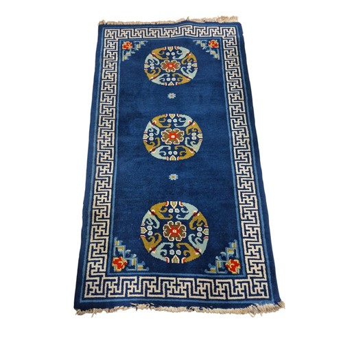 571 - A BLUE, LIGHT PINK AND BEIGE GROUND PATTERN RUNNER, A BLUE GROUND PATTERN RUG with Greek Key border