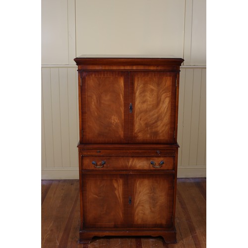 20 - A MAHOGANY AND SATINWOOD INLAID COCKTAIL CABINET of rectangular outline the shaped top above a pair ... 