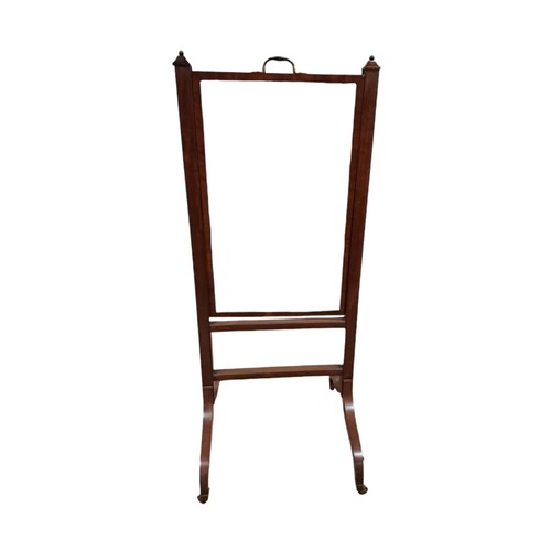 70 - A GEORGIAN MAHOGANY CHEVAL MIRROR the rectangular plate within a fall and rise frame with brass hand... 