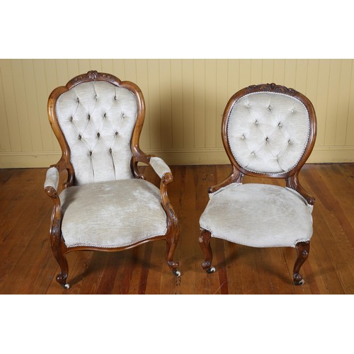 72 - A VICTORIAN CARVED MAHOGANY AND UPHOLSTERED LADY'S AND GENTLEMAN'S CHAIR each with a carved top rail... 