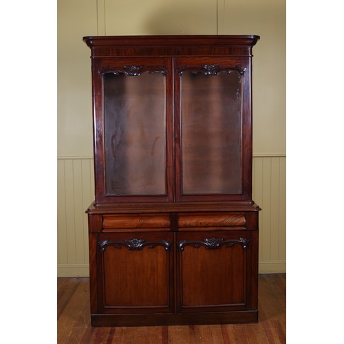 189 - A VICTORIAN MAHOGANY TWO DOOR LIBRARY BOOKCASE the moulded cornice above a pair of glazed doors cont... 