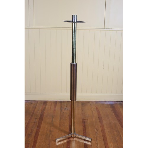 213 - A VINTAGE BRASS CANDLESTICK the cylindrical column with drip pan on tripod base 153cm (h)