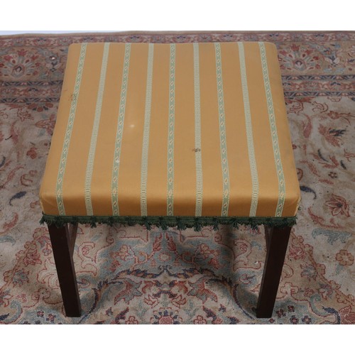 477 - A 19TH CENTURY MAHOGANY AND UPHOLSTERED STOOL the square upholstered seat on chamfered moulded legs ... 