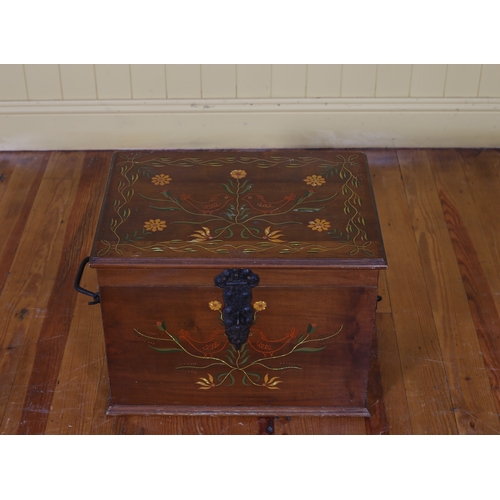 90 - A PINE AND POLYCHROME TRUNK the rectangular hinged lid decorated with stylised flowerheads and folia... 