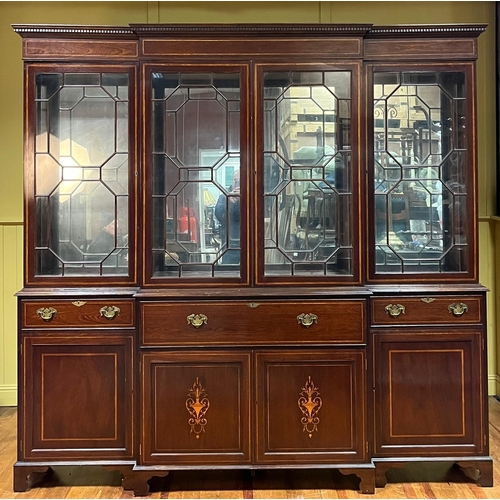 365 - A GEORGIAN STYLE MAHOGANY AND SATINWOOD INLAID BREAKFRONT SECRETAIRE BOOKCASE the dentil moulded cor... 