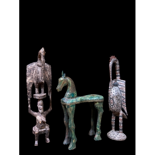 112 - THREE AFRICAN CARVED WOOD AND POLYCHROME FIGURES modelled as a horse 90cm (h) x 72cm (w) x 23cm (d),... 