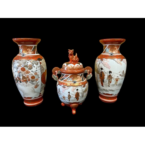 116 - A THREE PIECE JAPANESE PORCELAIN VASE GARNITURE comprising a pair of baluster shaped vases each deco... 