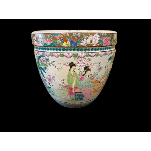 117 - A CHINESE FAMILLE ROSE STYLE JARDINIERE of circular tapering form decorated overall with figures amo... 