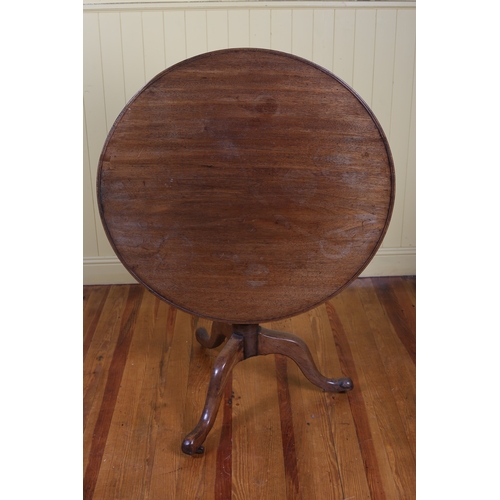 14 - A 19TH CENTURY MAHOGANY SNAP TOP TABLE the circular dished top above a baluster column on tripod sup... 