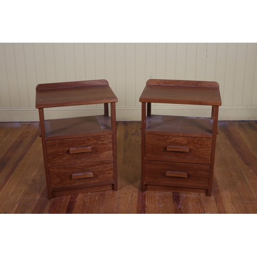 178 - A PAIR OF VINTAGE TEAK PEDESTALS each of rectangular outline the shaped top with open compartment ab... 