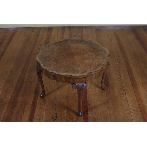 180 - A VINTAGE WALNUT CROSSBANDED OCCASIONAL TABLE the shaped top on cabriole legs with pad feet 40cm (h)... 