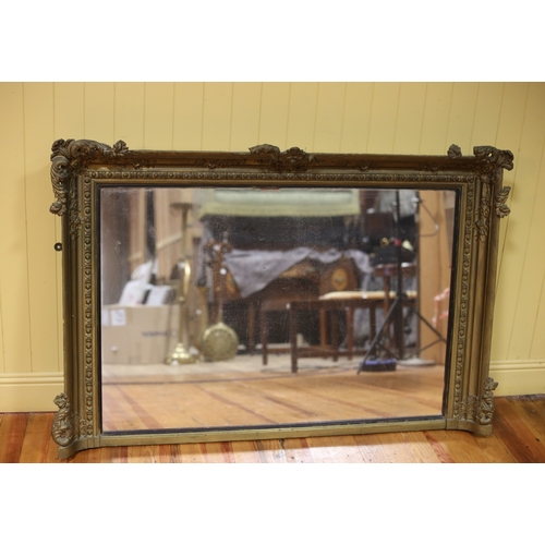 20 - A 19TH CENTURY GILTWOOD AND GESSO OVERMANTEL MIRROR the rectangular plate within an egg and dart fol... 