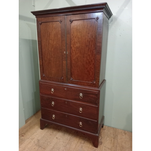 205 - A 19TH CENTURY MAHOGANY LINEN PRESS ON CHEST the dentil moulded cornice above a pair of cupboards co... 