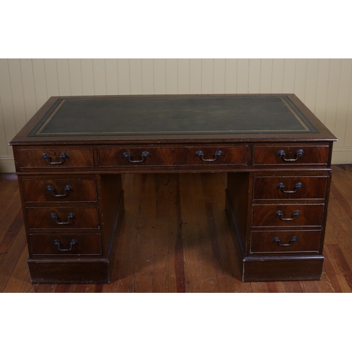 209 - A GEORGIAN STYLE MAHOGANY PEDESTAL DESK of rectangular outline the shaped top with tooled leather wr... 