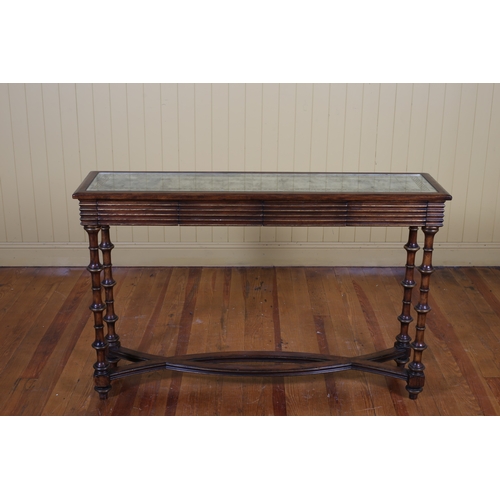 232 - A CHERRYWOOD PARCEL GILT AND GLAZED CONSOLE TABLE of rectangular outline the shaped top with mirrore... 