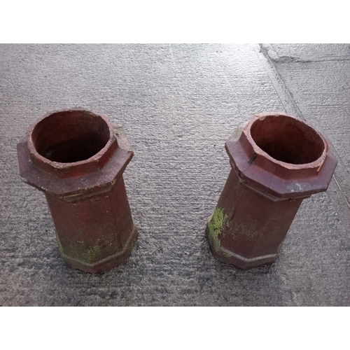 235 - A PAIR OF TERRACOTTA CHIMNEY POTS each of octagonal outline 61cm (h) x 34cm (d)