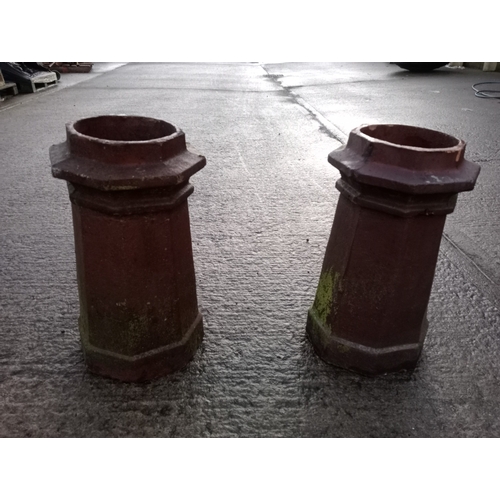 235 - A PAIR OF TERRACOTTA CHIMNEY POTS each of octagonal outline 61cm (h) x 34cm (d)