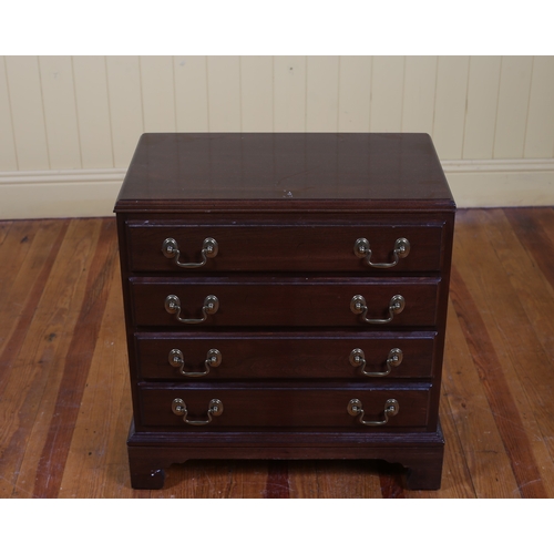 26 - A GEORGIAN STYLE MAHOGANY CHEST of rectangular outline the shaped top above four long drawers with b... 