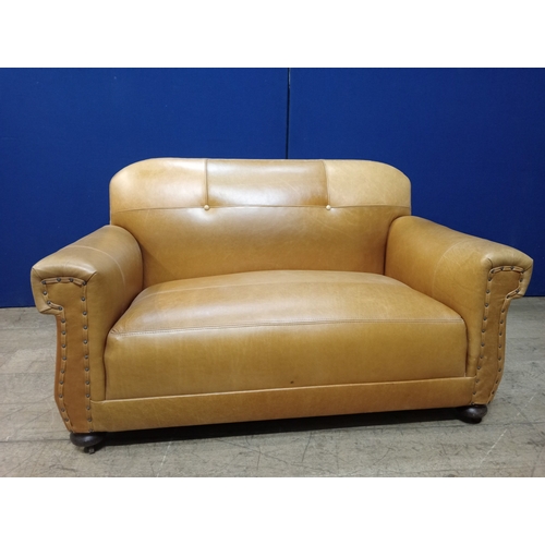 263 - A LATE 19TH CENTURY HIDE UPHOLSTERED TWO SEATER SETTEE the shaped upholstered back and seat with scr... 