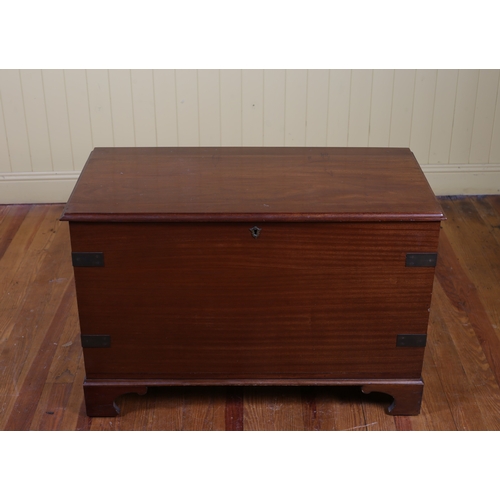 27 - A MAHOGANY AND BRASS BOUND TRUNK the hinged top with moulded apron on bracket feet 63cm (h) x 94cm (... 