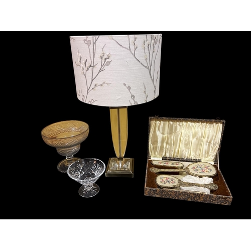 288 - A VINTAGE THREE PIECE GILT METAL DRESSING TABLE SET in original presentation box, a Continental glaz... 