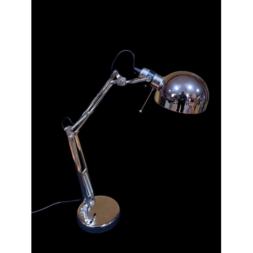 291 - A CHROME ANGLEPOISE DESK LAMP raised on a circular foot 44cm (h)