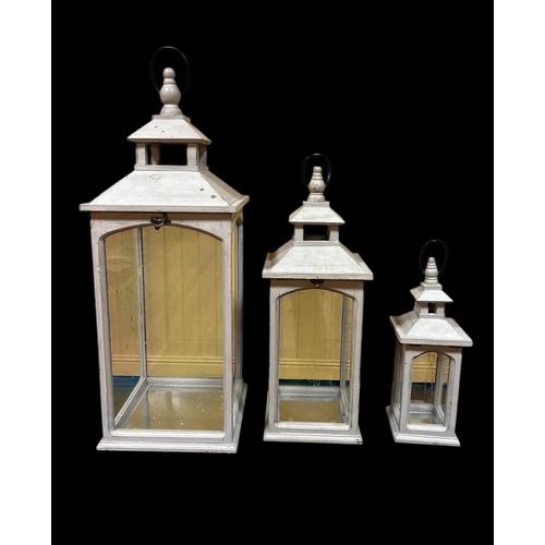 295 - A SET OF THREE GRADUATED PINE AND GREY PAINTED LANTERNS each of rectangular form with carrying handl... 