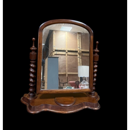 296 - A 19TH CENTURY MAHOGANY CRUTCH FRAME MIRROR the rectangular arched plate within a moulded frame rais... 