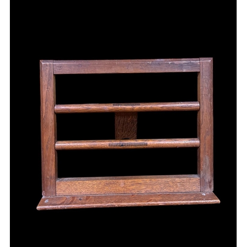 299 - A VINTAGE OAK LECTERN the rectangular frame with cylindrical barring 28cm (h) x 39cm (w)