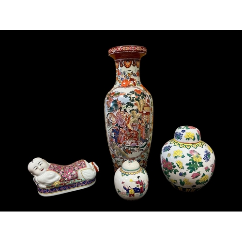 309 - TWO ORIENTAL LIDDED GINGER JARS, an Imari style vase of ovoid tapering form the white, indigo and pu... 