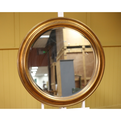 327 - A GILT FRAME MIRROR the circular bevelled glass plate within a moulded frame 100cm (d)