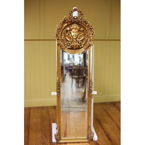 328 - A CONTINENTAL GILT FRAME MIRROR the shaped bevelled glass plate within a roped work moulded frame wi... 