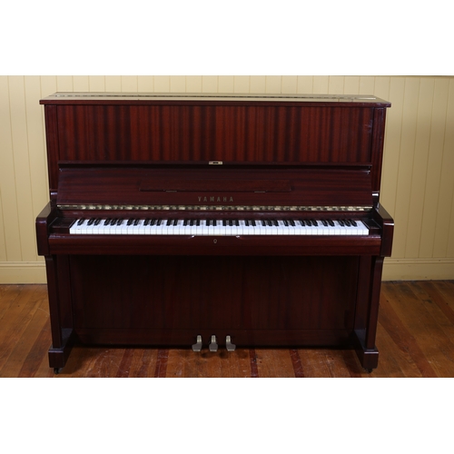 33 - A YAMAHA MAHOGANY CASED UPRIGHT PIANO Serial No. 4035465 steel frame and overstrung 121cm (h) 151cm ... 