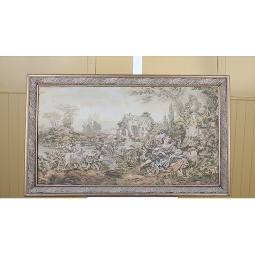 330 - A CONTINENTAL NEEDLEWORK FRAMED PANEL depicting figures in a wooded landscape with mill in backgroun... 