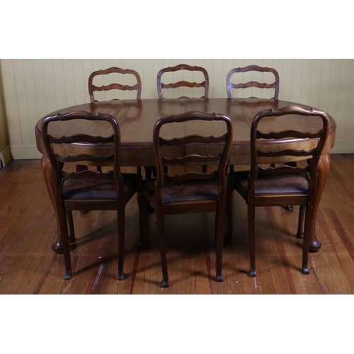 34 - A NINE PIECE DINING ROOM SUITE comprising eight walnut ladder back dining chairs with upholstered dr... 